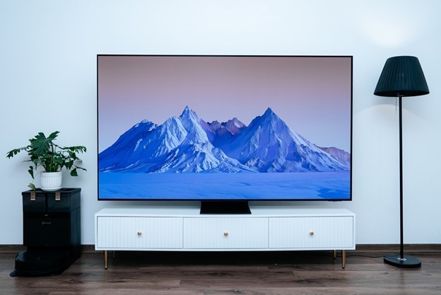 A tv on a standDescription automatically generated