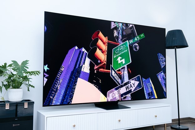 A tv on a standDescription automatically generated
